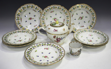A set of eight hard paste porcelain plates, 19th century, painted in French style with scattered flo