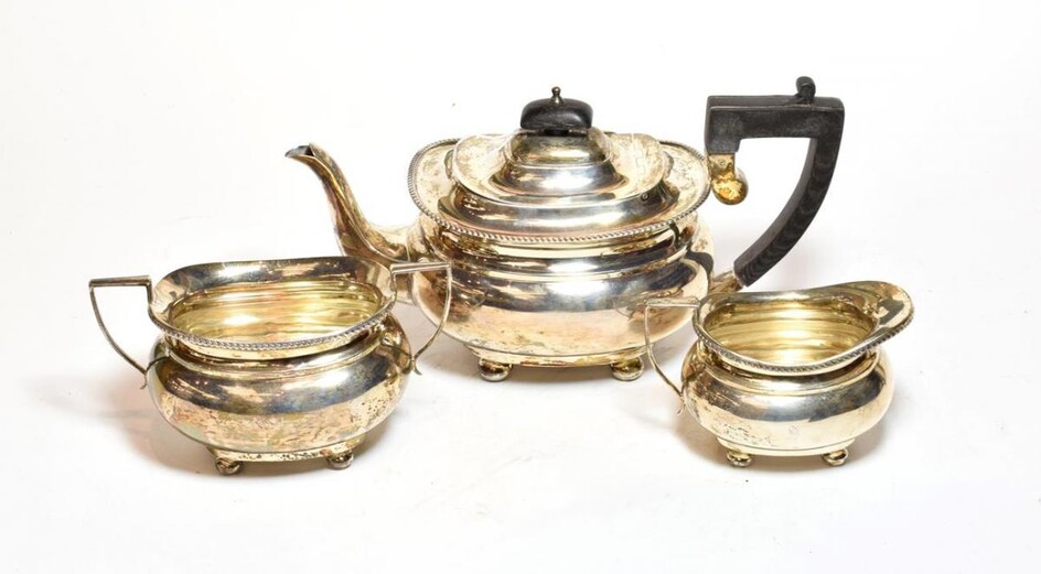 A three-piece George V silver tea service, by Herbert Edward...