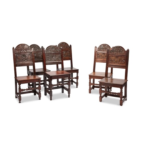 A well matched set of six Charles II oak solid-seat ch...