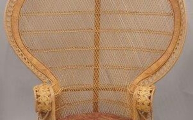 A wicker work peacock chair, second half 20th century, with loose upholstered seat cushion, 148cm high, 107cm wide.