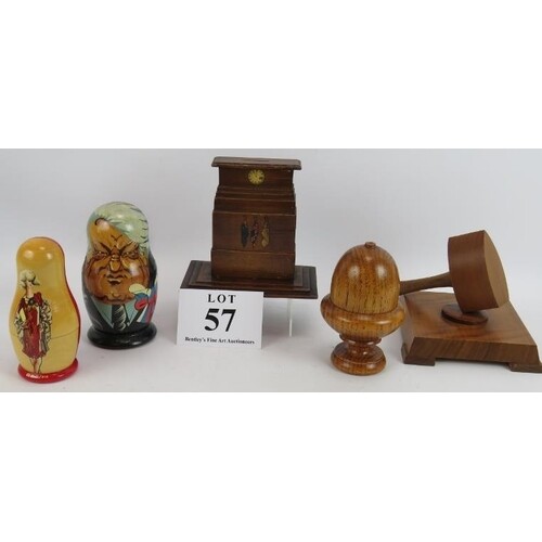 A wooden Cenotaph money box, a gavel and stand, a treen acor...