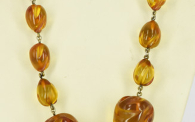 AN AMBER LIKE NECKLACE