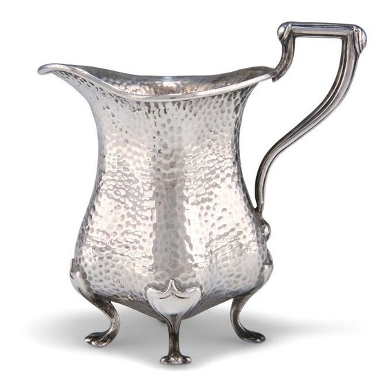AN ARTS AND CRAFTS SILVER CREAM JUG, by Edward Souter