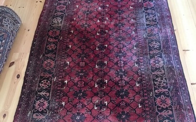 Afghan carpet, circa 1970. 193×106 cm.