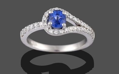 An 18 Carat White Gold Sapphire and Diamond Ring, the...