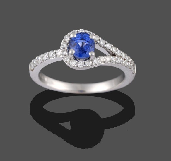 An 18 Carat White Gold Sapphire and Diamond Ring, the...
