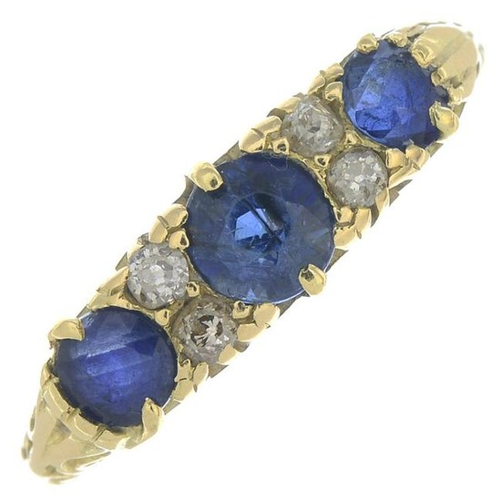 An 18ct gold Edwardian sapphire and diamond three-stone
