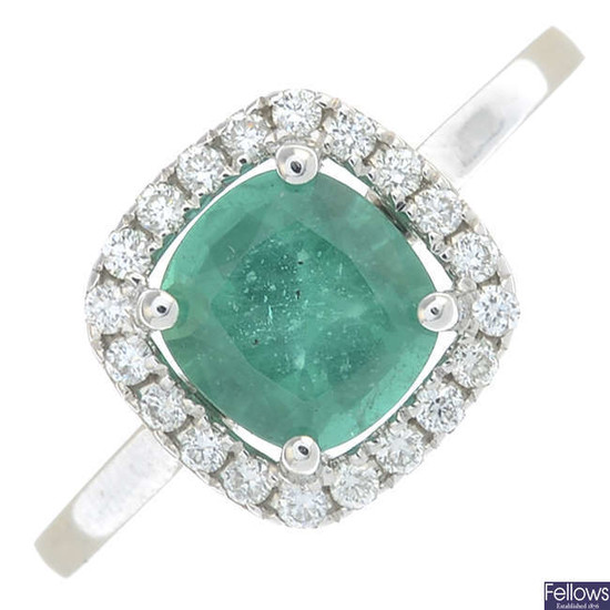 An 18ct gold cushion-shape emerald and brilliant-cut diamond cluster ring.
