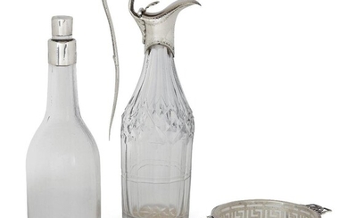 An 18th century silver mounted glass cruet bottle by Hester Bateman, date mark rubbed, designed with elongated handle and hinged lid with stylised shell thumbpiece, the bright-cut engraved collar to cut glass body, 18.3cm high, together with a...
