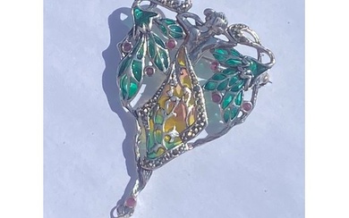 An Art Nouveau style silver and enamel pendant/brooch, with ...
