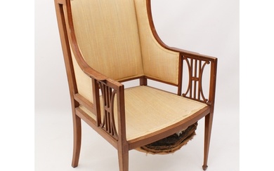 An Edwardian mahogany and satinwood open armchair in the She...
