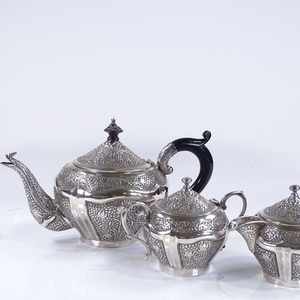 An Indian/Burmese unmarked silver 3-piece tea set, with all ...