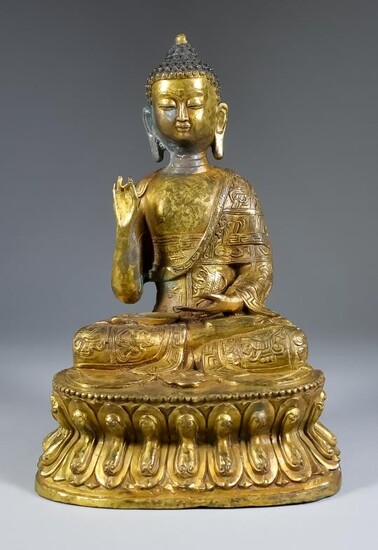 An Indo Chinese Gilt Bronze Figure of the Seated...