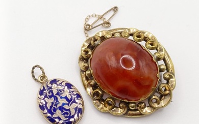 An early 20th century yellow coloured metal and amber colour...
