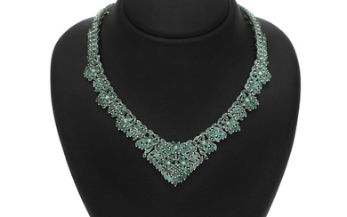 An emerald necklace set with numerous navette and circular-cut emeralds, mounted in rhodium plated sterling silver. L. app. 40.5 cm.