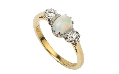An opal and diamond three stone ring, the central oval...