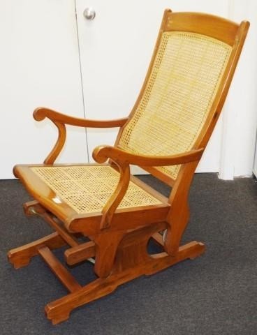Antique teak rocking chair with caned seat and back, 53cm wi...