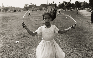 DIANE ARBUS (1923-1971) Child Skipping Rope at a Puerto Rican Festival, NY.