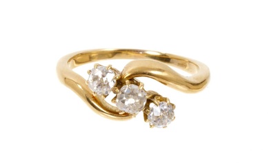 Diamond three stone ring in 18ct gold cross-over setting