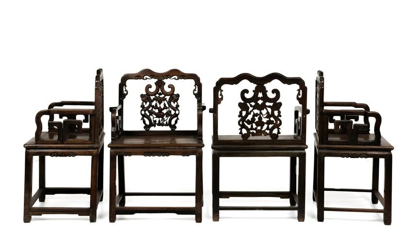 Four Chinese carved wood armchairs