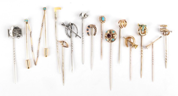Fourteen Stick Pins, including a diamond set horn and crop,...