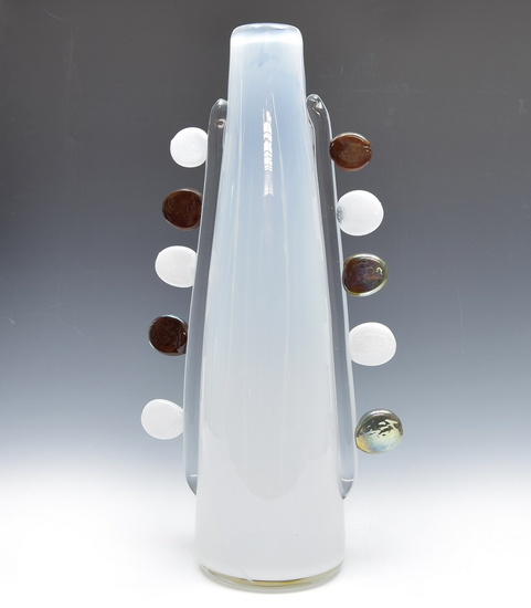 Large white glass vase with circular glass decoration on both...