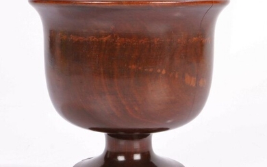 Late 17th Century treen sycamore goblet, the wide flared edge above a dumpy stem and circular
