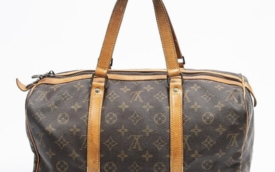 Louis Vuitton: A "Sac Souple" travel bag made of brown monogram canvas with brown leather trimmings and gold tone hardware. – Bruun Rasmussen Auctioneers of Fine Art