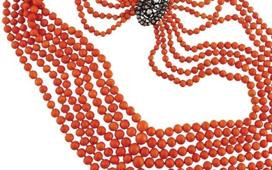 NECKLACE with seven strands of sloping coral balls...