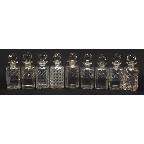 Nine 19th century cut glass decanters with stoppers, each ap...
