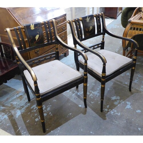 OPEN ARMCHAIRS, a pair, Regency style, black and gilt with p...