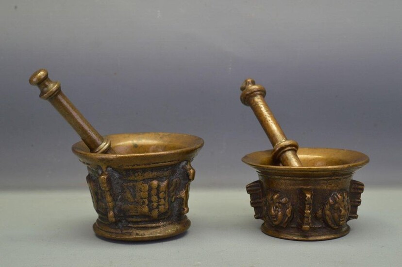 Pair of bronze mortars and pestle with brown...