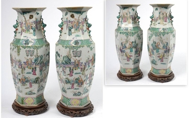 Pair of large hexagonal vases in polychrome porcelain of China called "Green Family" with "Old wise men in a landscape" decoration. Period: 19th century. Resting on wooden bases. (* and **). H.(without base):+/-59,3cm.