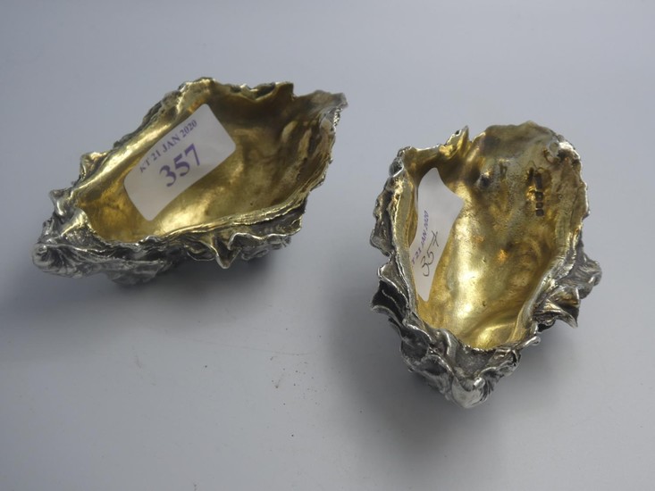 Pair of modern designer cast silver crustacean salts with gi...