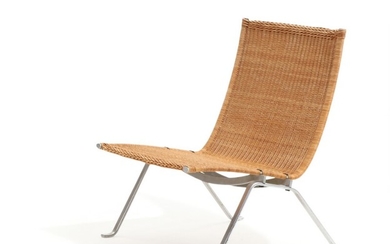 Poul Kjærholm: “PK 22”. An easy chair with steel frame, seat and back with woven cane. Manufactured and stamped by E. Kold Christensen.