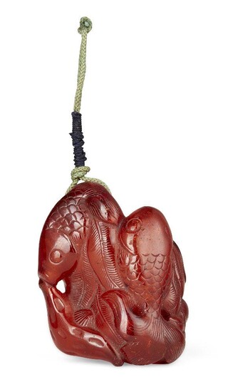 Property of a Gentleman (lots 36-85) A Chinese carved amber 'fish' pendant, Qing dynasty, late 19th century, carved as two fish amidst pond weeds, 6cm long