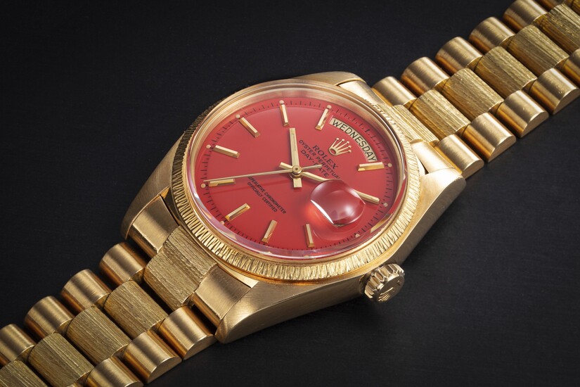 ROLEX, DAY-DATE REF. 1807, A GOLD AUTOMATIC WRISTWATCH WITH CORAL STELLA LACQUER DIAL
