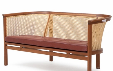 SOLD. Rud Thygesen & Johnny Sørensen: “Kongeserien”. Two-seater sofa with mahogany frame. Back with woven cane, seat with red leather. – Bruun Rasmussen Auctioneers of Fine Art