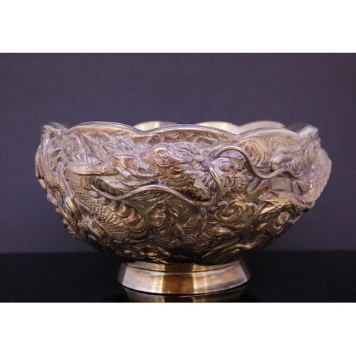 CHINESE SILVER DRAGON BOWL, decorated all around with a drag...