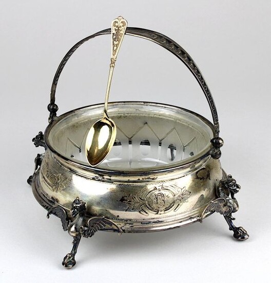 Silver Historicism handle bowl with glass insert, German circa 1888, round silver mount with 4 feet in the shape of fully sculpted griffins, the sides with 4 engraved cartouches with monograms resp. anniversary dates 1863-1888, laterally on the sides...