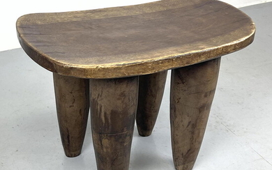 Solid wood rustic Senufo stool. In the style of African Senufo