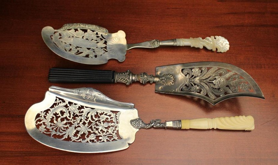 Three 19th Century Continental Silver Fish Servers with intricately pierced and engraved blades; one