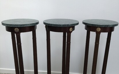 Three 20th century pedestals with tops of green marble. H. 82.5 cm. Diam. 30 cm. (3)