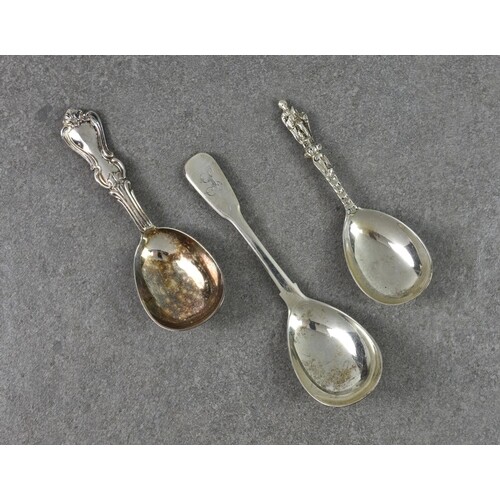Three silver caddy spoons, to include a George III fiddle pa...