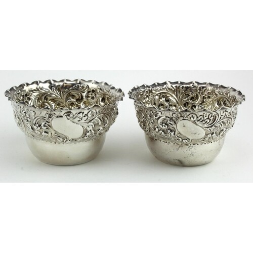Two Victorian ornate silver bowls, hallmarked CE London 1894...