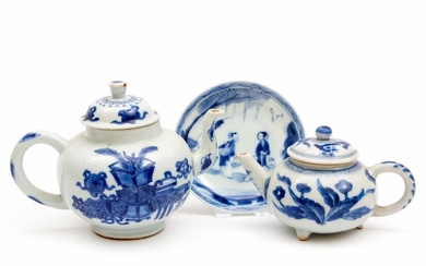 Two blue and white teapots and a saucer
