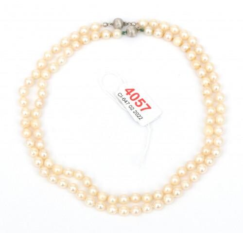 Two cultured Akoya pearl necklaces to a 14 krt white gold clasp. Gross weight 47.7 g.