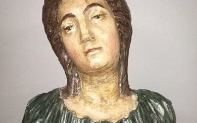 Woman's bust resting on a base. Polychrome plaster....