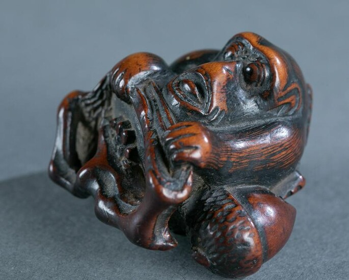 Wood netsuke of a monkey, 18th-19th century.