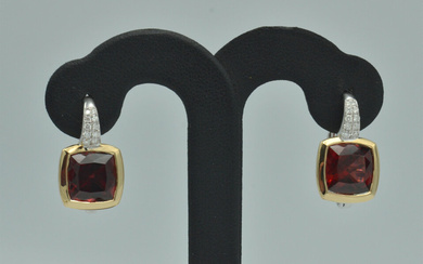 Yellow and white gold earrings with African garnets and diamonds 21st century. 18k gold. 2 antique cut garnet gemstones, 7.33 ct. 20 brilliant cut diamonds 0.21 ct. Quality G-VS. Weight 8.40 g.